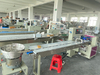 Vibrating plate automatic feeding compression mask packaging machine